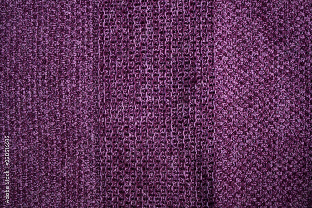 Magenta knitted cotton fabric with textured stripes abstract background