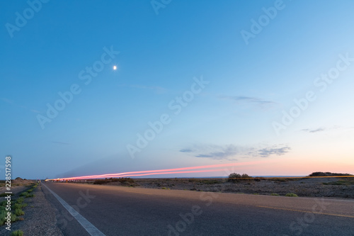 light trails on road in gobi desert