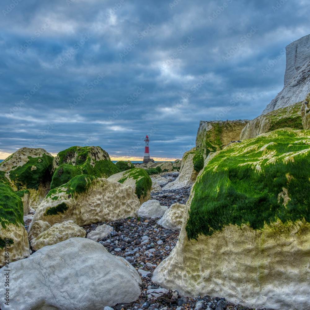 Beachy Head Light from the beach on an autumn evening sunset with HDR processing, East Sussex, UK Beachy Head Light from the beach on an autumn evening sunset with HDR processing, East Sussex, UK