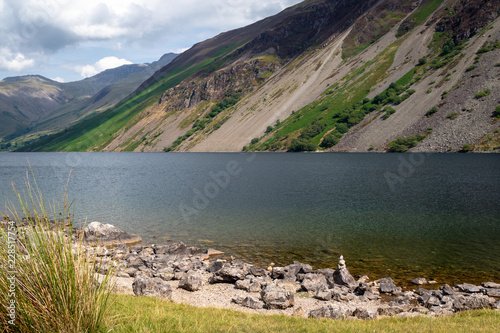 Rocks in crystal clear water of Wast Water lake in the Lake District National Park, the UK