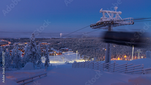 Levi village in Finland, modern ski resort in Lapland, blurry cable car gondola photo