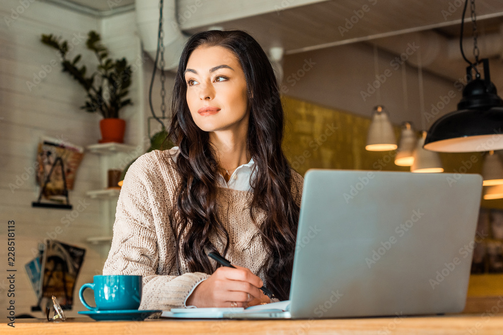 attractive brunette freelancer working with laptop in cafe with coffee cup attractive brunette freelancer working with laptop in cafe with coffee cup