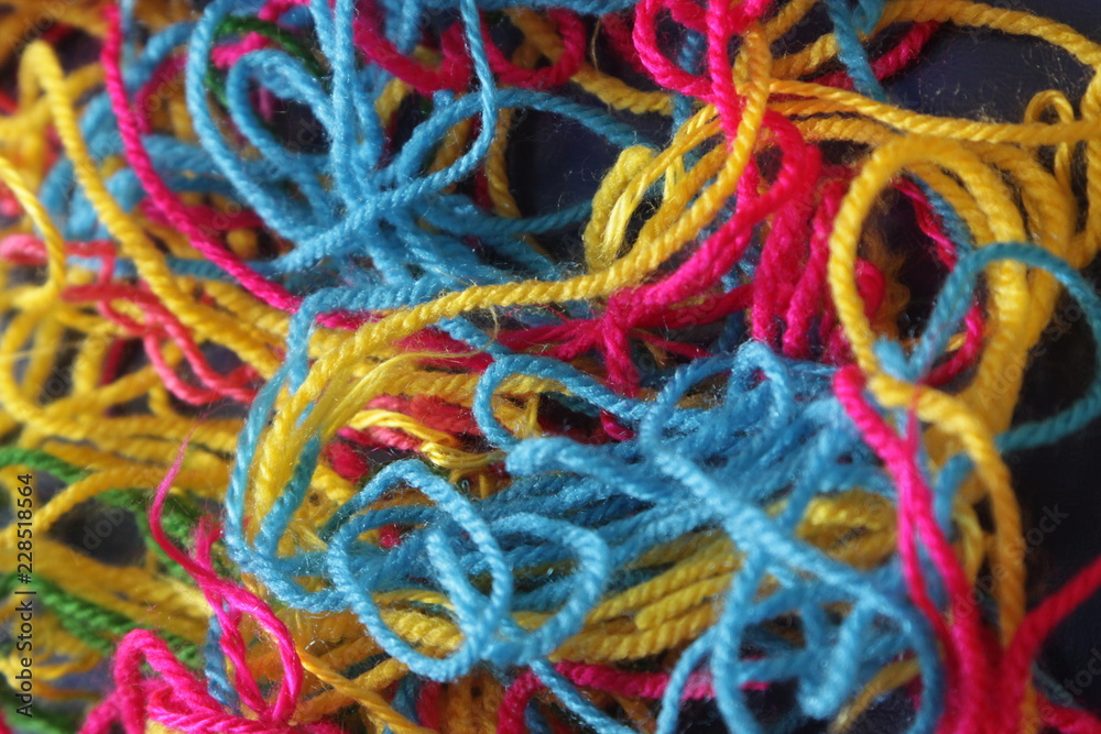 Tangled multicolored threads making a colorful pattern