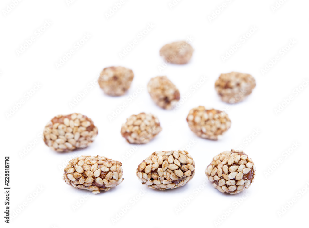 Coated peanuts with sesame isolated on white background