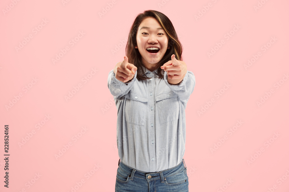 I choose you and order. The smiling business woman point you, want you, half length closeup portrait on pink studio background. The human emotions, facial expression concept. Front view. Trendy colors I choose you and order. The smiling business woman point you, want you, half length closeup portrait on pink studio background. The human emotions, facial expression concept. Front view. Trendy colors