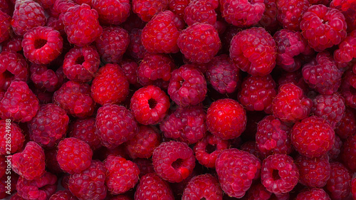 Fresh raspberries background.  Closeup photo, top view.