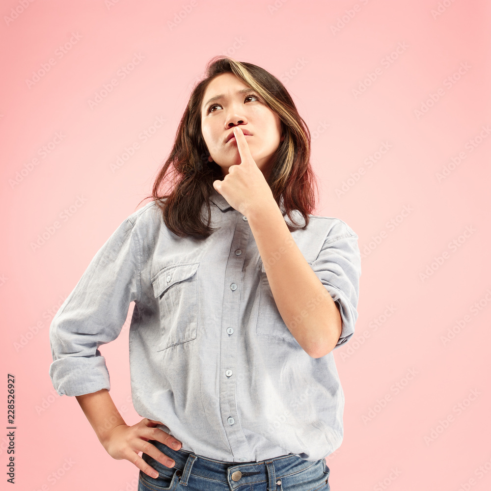 Remember all. Let me think. Doubt concept. Doubtful, thoughtful woman remembering something. Young emotional woman. Human emotions, facial expression concept. Studio. Isolated on trendy pink Remember all. Let me think. Doubt concept. Doubtful, thoughtful woman remembering something. Young emotional woman. Human emotions, facial expression concept. Studio. Isolated on trendy pink