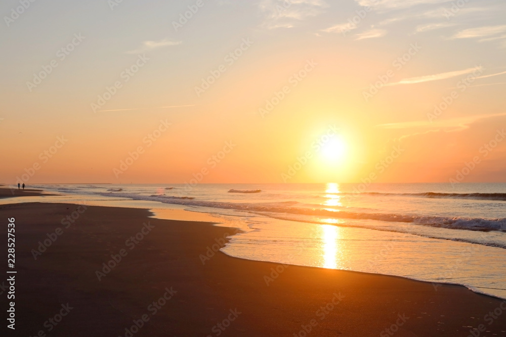 Beautiful sunrise over the ocean nature background.Southern marine landscape with sun rising over the atlantic ocean at the Huntington Beach State Park, Litchfield, Myrtle Beach area, South Carolina.