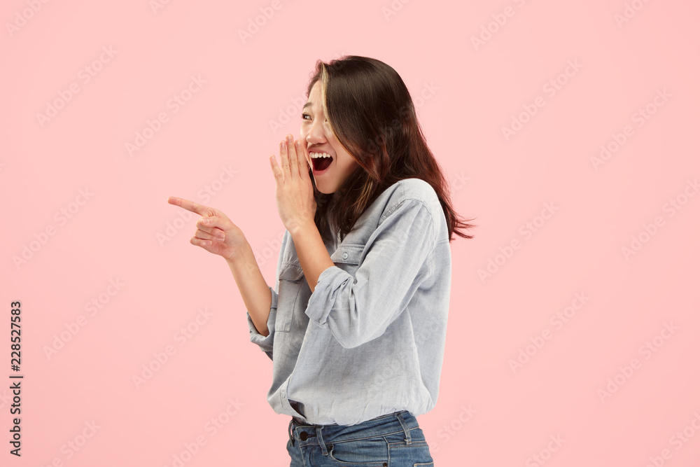 Secret, gossip concept. Young woman whispering a secret behind her hand. Business woman isolated on trendy studio background. Young emotional woman. Human emotions, facial expression concept. Secret, gossip concept. Young woman whispering a secret behind her hand. Business woman isolated on trendy studio background. Young emotional woman. Human emotions, facial expression concept.