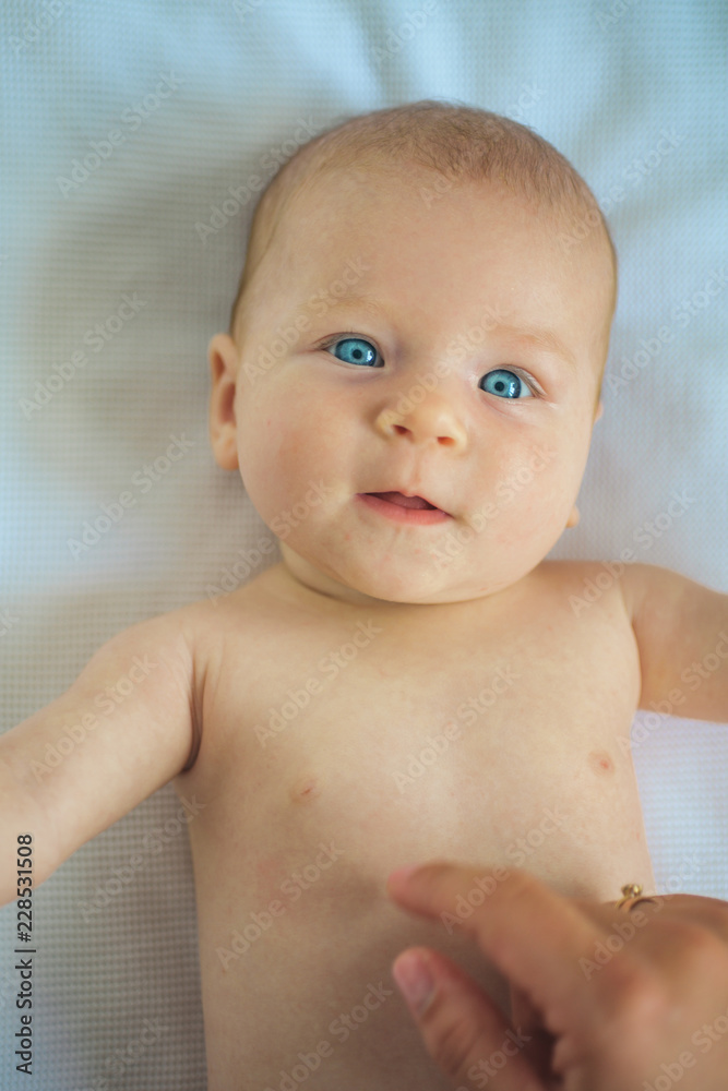 Happy newborn baby. Care stomach cramps for happy baby. Newborn girl or boy. Health care to relieve cramps and colic. Its about caring Happy newborn baby. Care stomach cramps for happy baby. Newborn girl or boy. Health care to relieve cramps and colic. Its about caring