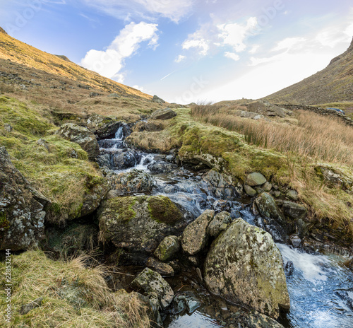 Small stream on a mountainside, Kirkstone Pass, Lake District. Cumbria, UK.
