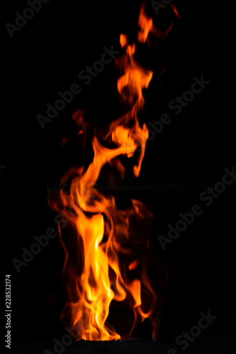 red and orange burning fire flames on black background.