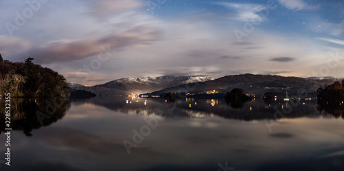 Panorama of Lake Windermere at night with Stars. Lake District, Cumbria UK.