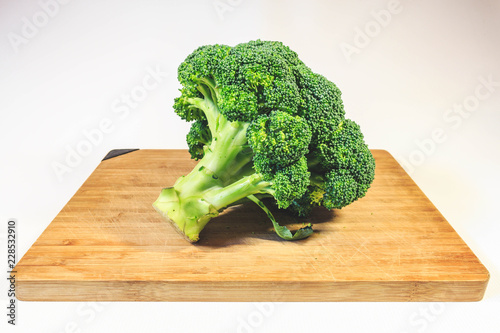 Broccoli cabbage fresh greens on a wooden board