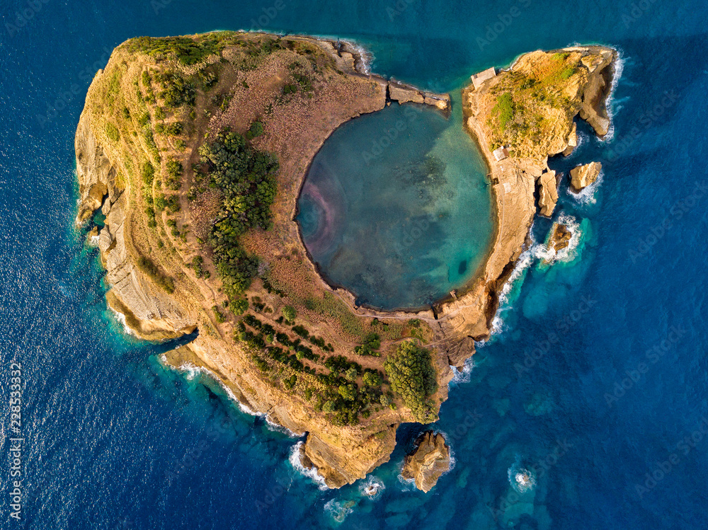 Fototapeta premium Top view of Islet of Vila Franca do Campo is formed by the crater of an old underwater volcano near San Miguel island, Azores, Portugal. Bird eye view, aerial panoramic view.