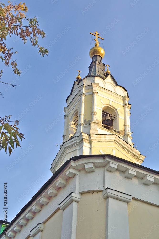 Obraz premium belfry of the old church in October