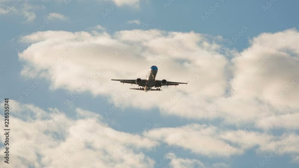 Telephoto shot of a large airliner approaching the airport moments before landing on a bright sunny day Telephoto shot of a large airliner approaching the airport moments before landing on a bright sunny day