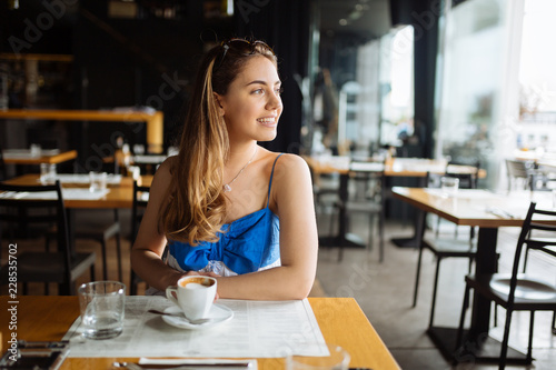 Beautiful woman enjoying her coffee