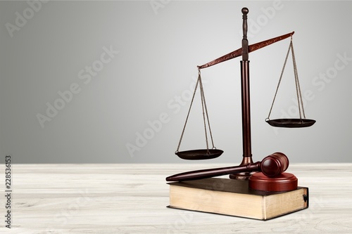 Justice Scales and books and wooden gavel on table. Justice
