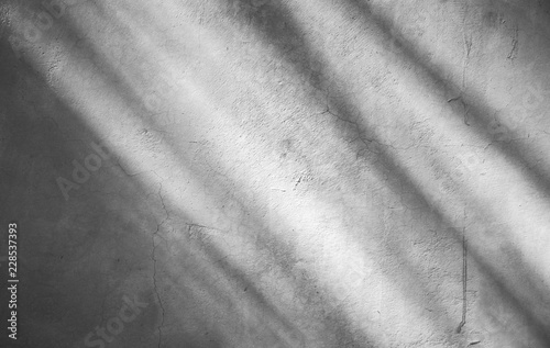 white concrete wall with shadows from the window - Abstract background