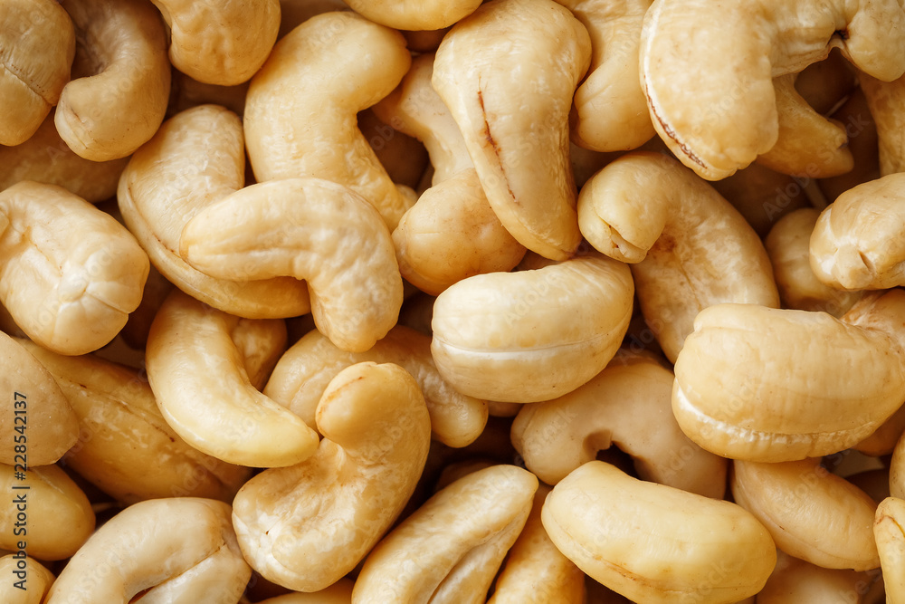 Cashew with no shell on a background. Macro nuts, Organic vegan food. Cashew with no shell on a background. Macro nuts, Organic vegan food.
