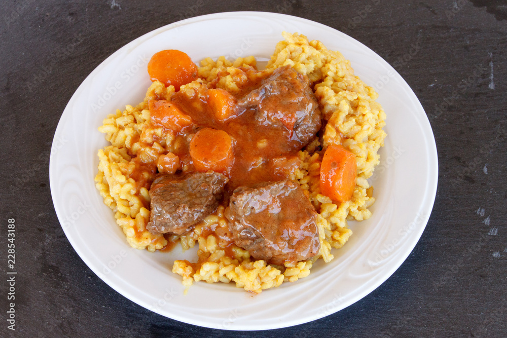 Veal in red sauce and rice with turmeric Veal in red sauce and rice with turmeric