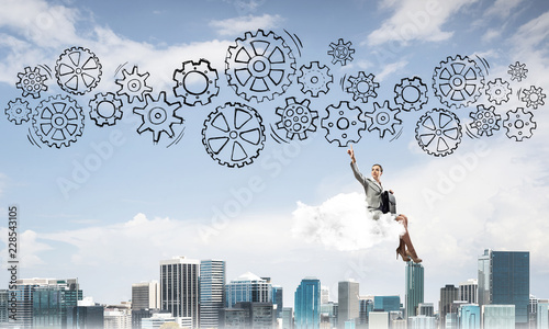 Business lady float on cloud touching drawn gear mechanism