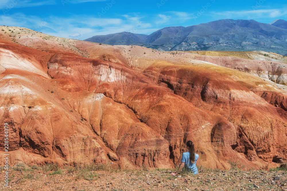 Woman in valley of Mars landscapes in the Altai Mountains, Kyzyl Chin, Siberia, Russia