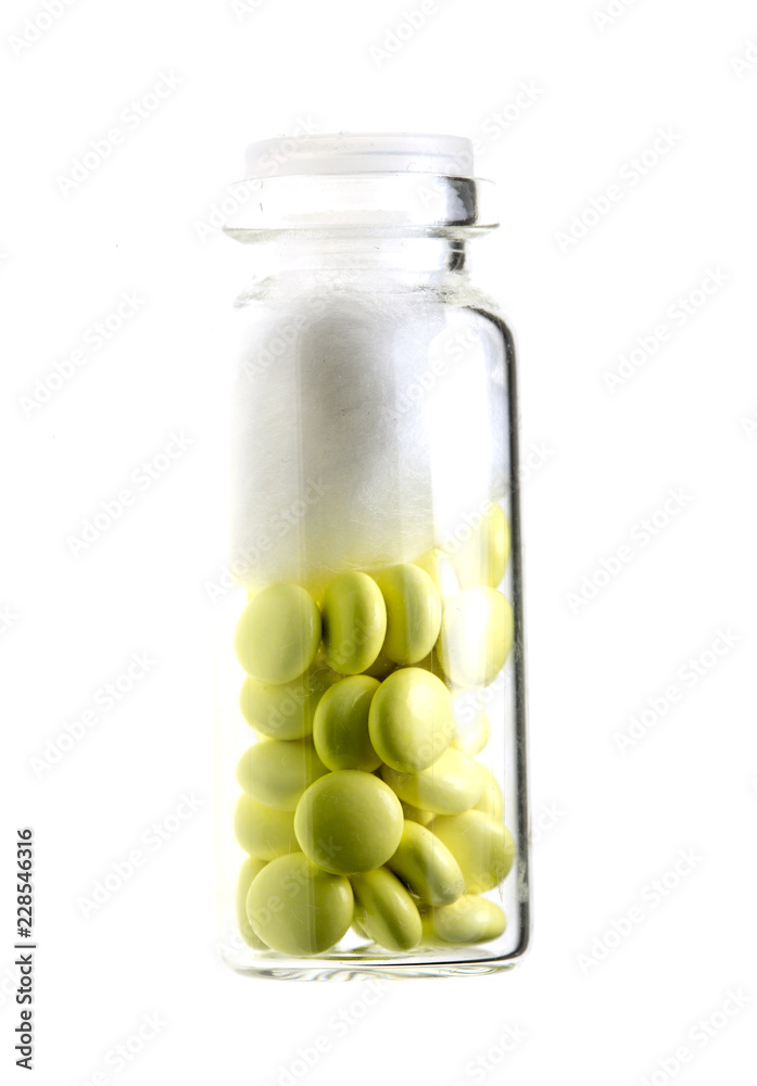 bottle of yellow medical valerian pills on a white background, herb medicine bottle of yellow medical valerian pills on a white background, herb medicine