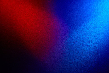 The combination of dark red and blue on a black background