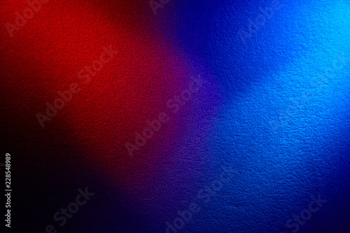 The combination of dark red and blue on a black background