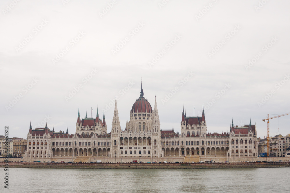 Parliament building in Budapest in cloudy weather