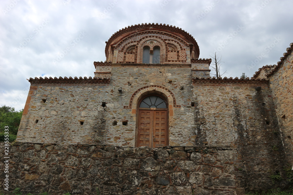 Entrance to medieval greek church in the ruins of abandoned ancient city of Mystras, Peloponnese, Greece