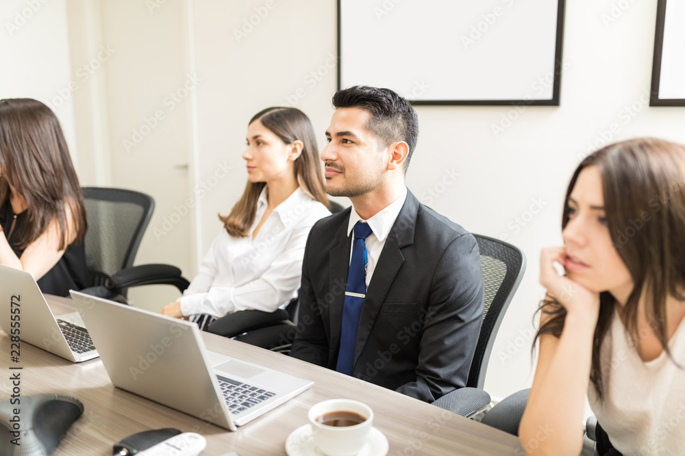 Fotografie Focused And Engaged In Long Meeting