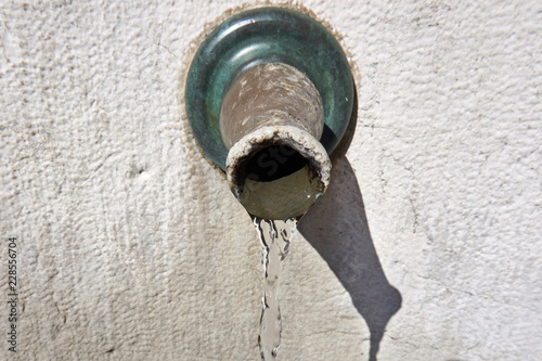 Drinking water flowing from a tap