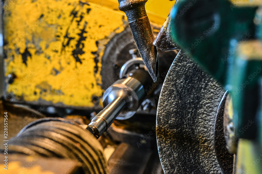 Abrasive wheel on the grinding machine close-up. Abrasive wheel on the grinding machine close-up.