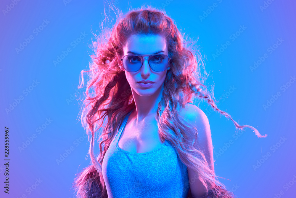Fototapeta High Fashion. Party Girl in Colorful neon light.