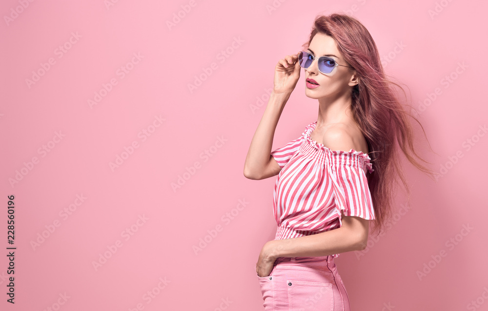 Fashion. Blonde Girl Posing in Studio on Pink Fashion. Blonde Girl Posing in Studio on Pink