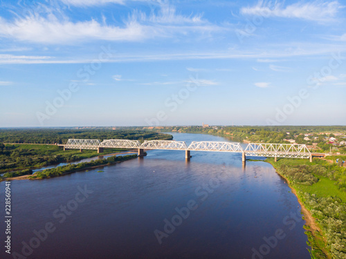 a panorama from a height  a typical small city in central Russia and the river Vyatka with railroad bridge