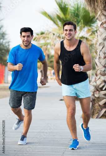 Two friends are jogging in time training
