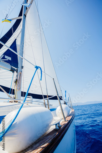 Sailing. Ship yachts with white sails in the open Sea.