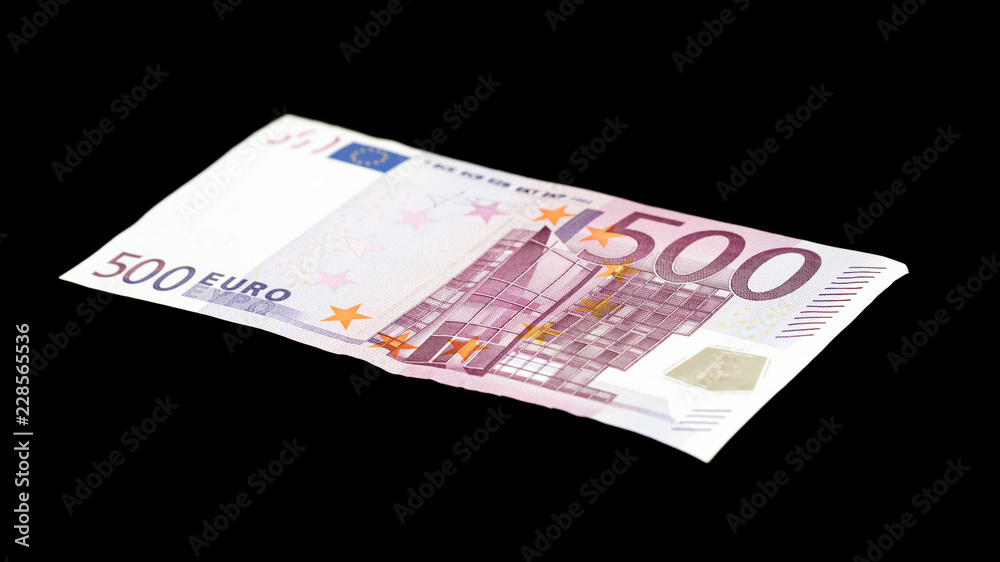 five hundred euros on a black background five hundred euros on a black background