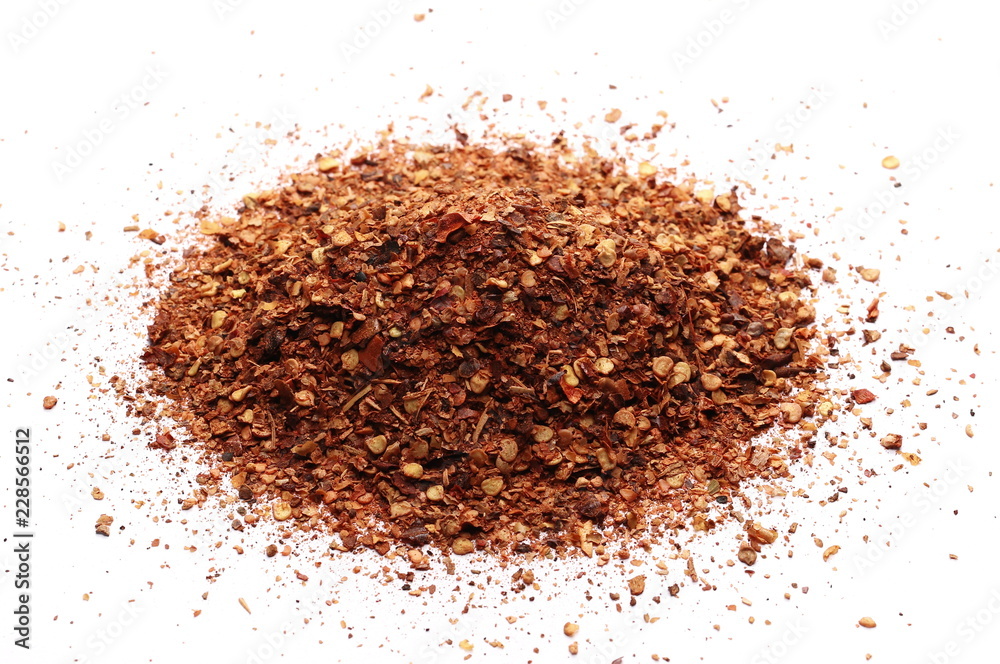 pile dry crushed red pepper, dried chili flakes and seeds isolated on white background pile dry crushed red pepper, dried chili flakes and seeds isolated on white background