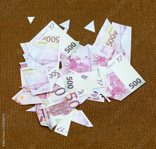 small pieces five hundred euros on a fabric background rope