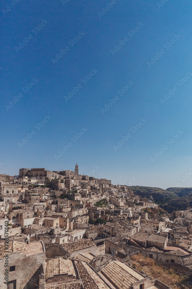 The sassi of Matera, Italy under blue sky