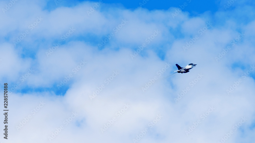 Military aircraft flying over blue