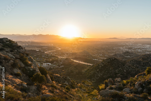 Los Angeles sunrise view of Porter Ranch and the 118 freeway in the San Fernando Valley.  The San Gabriel Mountains, Burbank and North Hollywood, California are in the background.   © trekandphoto