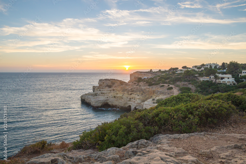 Summer sunset by Algar Seco on the Algarve, Portugal.