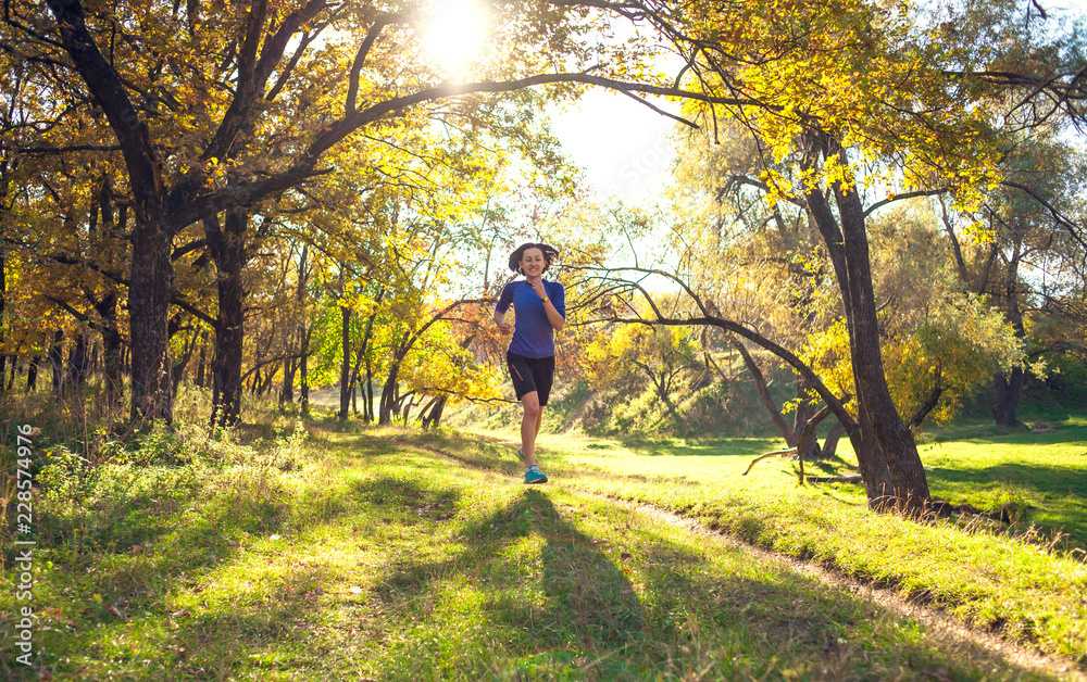 Fototapeta premium Woman trains in nature