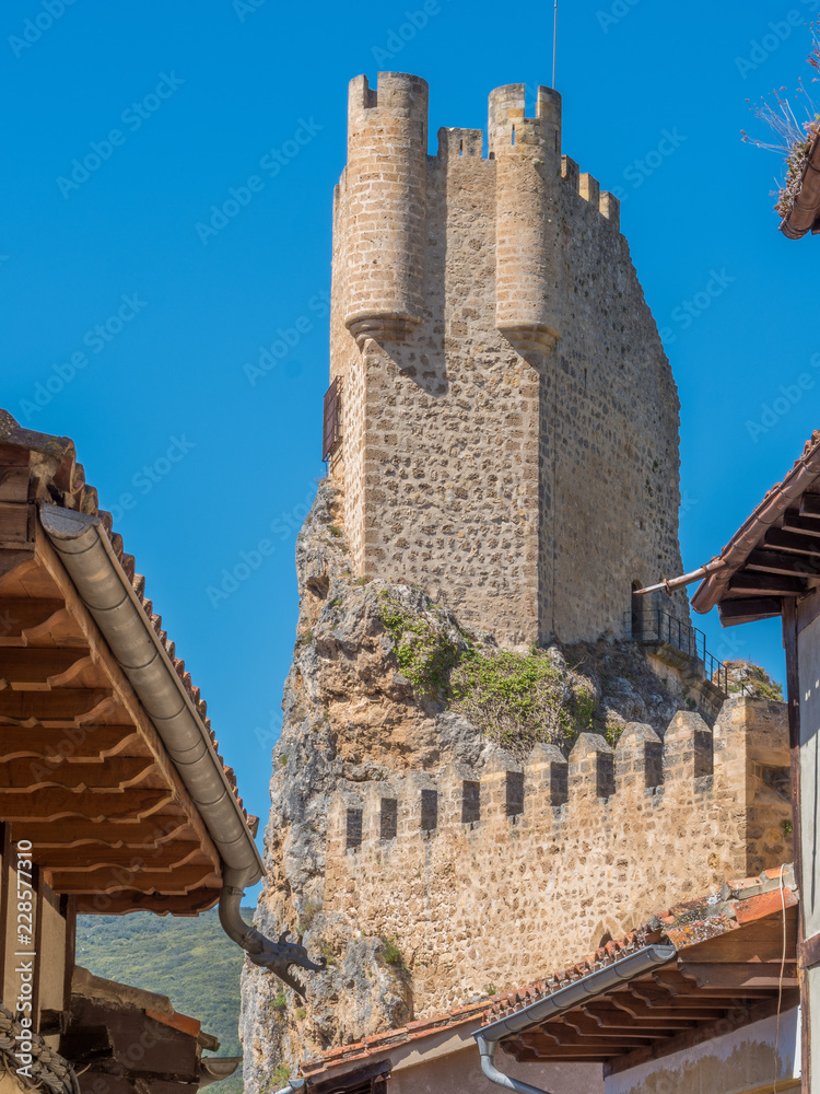 medieval tower with roofs in the village of Frias